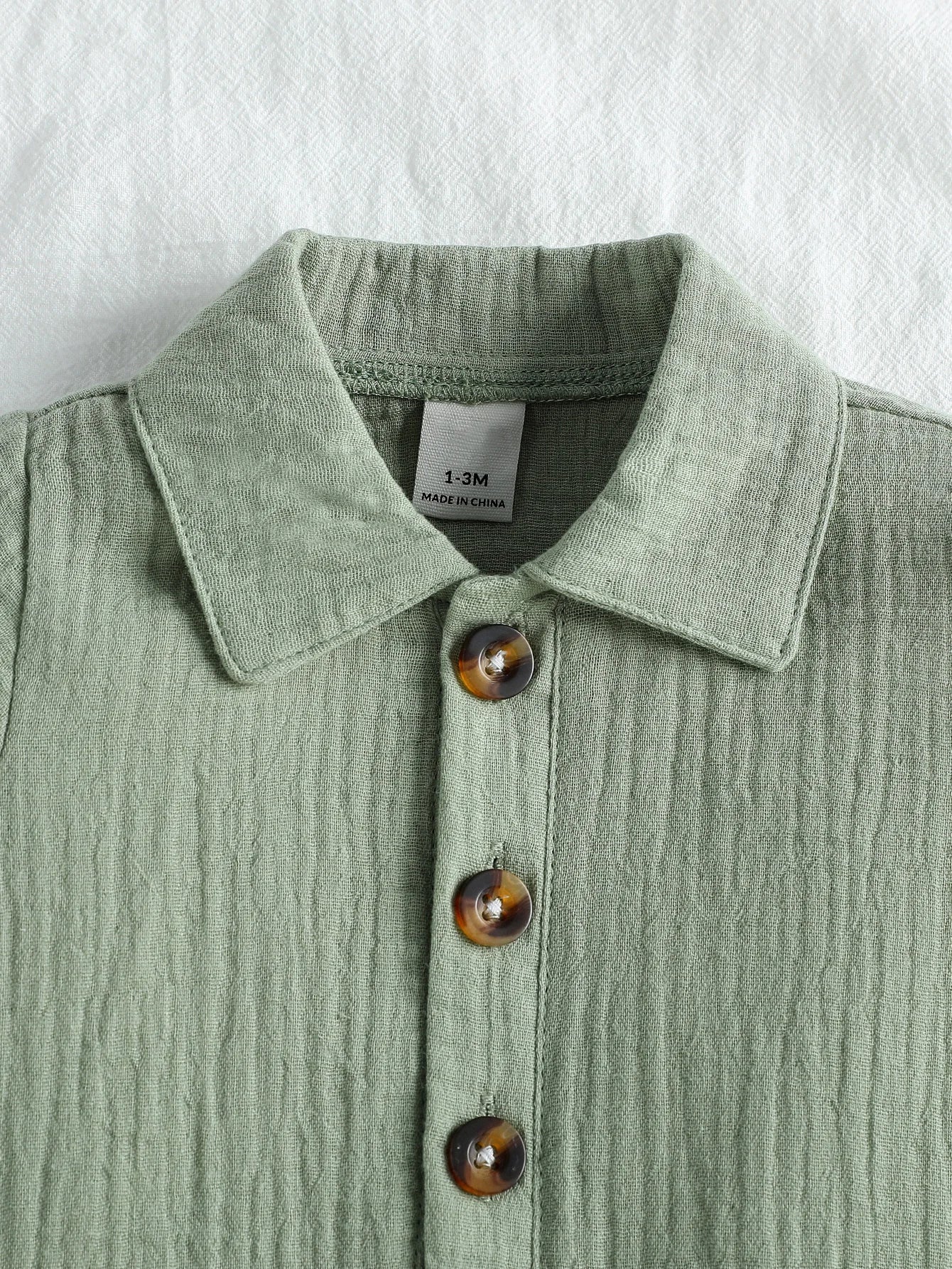 אוברול ניובורן - שקד